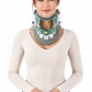 A woman wearing a cervical collar neck brace with a shark-tooth design, shown against a plain white background.