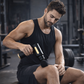 Black and gold portable percussion massage gun with 4 interchangeable massage heads for muscle recovery. 5