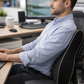 Black memory foam lumbar support pillow for office chair with ergonomic contoured design and tan piping. 3