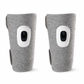 Pair of gray cordless air compression leg massagers with built-in LCD control panels for calf muscle recovery and circulation. 