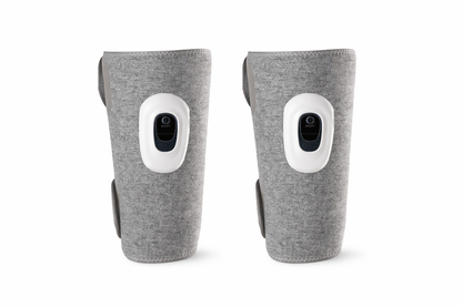 Pair of gray cordless air compression leg massagers with built-in LCD control panels for calf muscle recovery and circulation. 